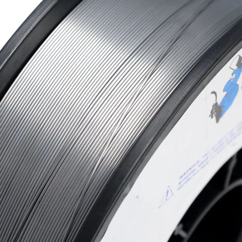 Close-up of E71TGS X.030 Inch Flux Core MIG Wire For Gasless GMAW On Carbon Steel, 10 Lb Spool, showing wire coiling