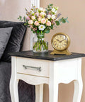 White bedside table with 10 Pack Zinc Alloy Twig Branch Cabinet Knob Set In Silver Decorative Pull Handles, flowers, and clock