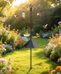 94 Inch Garden Bird Feeding Station Kit With Heavy Duty Metal Squirrel Baffle Seed Tray And Mesh Basket among flowers in yard