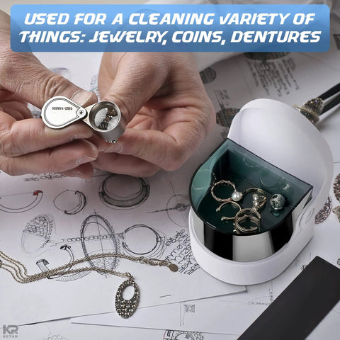 Cordless Jewelry And Denture Cleaner for rings, coins, and dentures, with hands holding a small metal piece over the unit