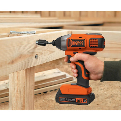20V Max Cordless Impact Driver Kit With One Quarter Inch Quick Release Chuck Delivers Up To One Thousand Three Hundred Seventy Five Inch Pounds Torque, Three Thousand RPM, And Three Thousand Nine Hundred IPM, Plus A Soft Touch Grip For Beast Mode in use on wood