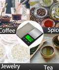 Pocket Digital Scale With 0.01g Precision And 1000g Capacity Backlit LCD surrounded by coffee, spices, jewelry, tea.