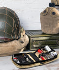 EDC Ready Military Style Survival Sewing Kit Tactical Pack with button tools on a wooden surface, featuring durable nylon material.