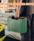 Person carrying Grab And Go Portable Butane Camping Stove With Carrying Case Precise Heat Control outdoors