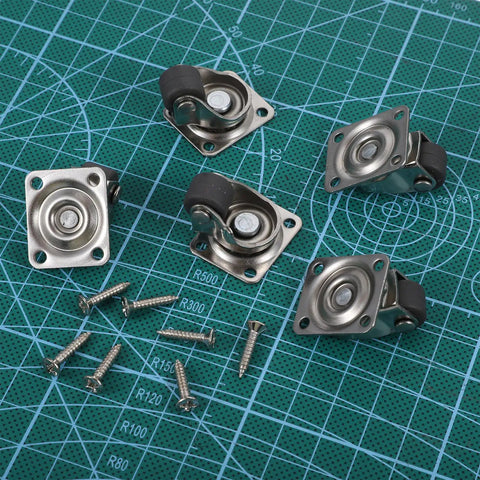 1 Inch Swivel Caster Wheels 8 Pack Mini Furniture Rollers With Self Adhesive Mounts Stainless Steel Nylon Core on a cutting mat with screws.