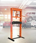 Hella 12 Ton Hydraulic Shop Press Engineered With Thick Steel H Frame in a garage, ideal for heavy industrial bearing swaps.