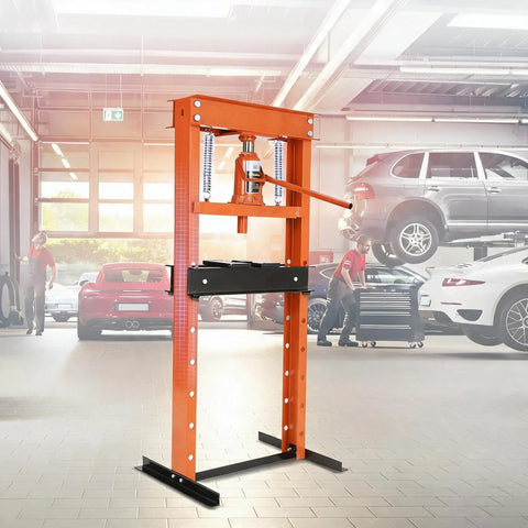Hella 12 Ton Hydraulic Shop Press Engineered With Thick Steel H Frame in a garage, ideal for heavy industrial bearing swaps.