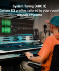 Audio engineer using ARC Studio Room Correction System with High Precision Microphone for system tuning in studio