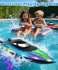 Children playing with Dual Prop RC Boat With LED Lights 14 Inch Remote Control Water Racer 2 4Ghz Fast Boat in a pool