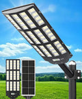 Y-12000W Solar Street Lights Outdoor With 6500K Daylight LED, Dusk To Dawn Parking Lot Flood Lights, Beast Brightness For Basketball Courts, Driveways, And Farms, Wide Coverage For Commercial Use mounted on pole with solar panel