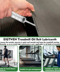 Applying Silicone Treadmill Lubricant 500ml For Smooth Quiet Belt Ride to a treadmill belt with a syringe applicator