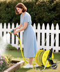 Woman using a 3Ft Short Garden Hose With Double Female Connectors For Quick Hose Reel Setup in outdoor garden watering flowers.