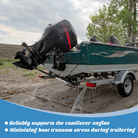 Side view of AHIER adjustable boat transom saver mounted on a green boat trailer, supporting a tilted outboard motor.