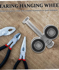 Stainless Steel Double Bearing Sliding Door Caster Wheel Kit with installation tools on a wooden surface