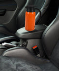 Heavy Duty 1000Ml Stainless Steel Car Electric Kettle And Water Heater on car armrest, ideal for truck drivers.
