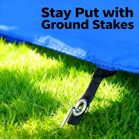 Close-up of ground stakes securing Foldable 10 Foot Dog Agility Tunnel With Carry Bag And Ground Spikes on grass, ensuring stability.