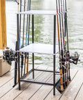 Garage Fishing Pole Organizer That Holds Ten Rods, Reels, Tackle Box, And Gear With Built In Shelves shown on a dock