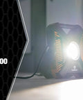 2000 Lumen LED Rechargeable Work Light With USB Power Outlet, Weatherproof IP67, shown illuminating a dark room corner