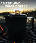Stainless Steel Percolator Coffee Pot With Glass View Top, No Aluminum Or Plastic, 12 Cup Capacity, on outdoor grill at sunset.