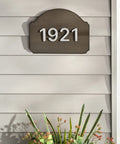 House number 1921 on dark wood plaque above flowers, showcasing use of No Mess Wood Stain And Applicator Kit, 4 Oz Dark Walnut.