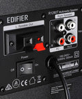 Back panel of R1280T Powered Bookshelf Speakers For Studio Monitoring 2.0 Active Near Field Monitors with inputs and controls.