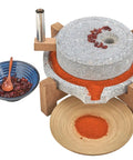Manual Stone Grain Mill For Dry And Wet Grinding, Granite Stone Grinder With Stable Wood Base, showcasing fresh ground spice.