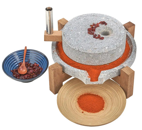 Manual Stone Grain Mill For Dry And Wet Grinding, Granite Stone Grinder With Stable Wood Base, showcasing fresh ground spice.