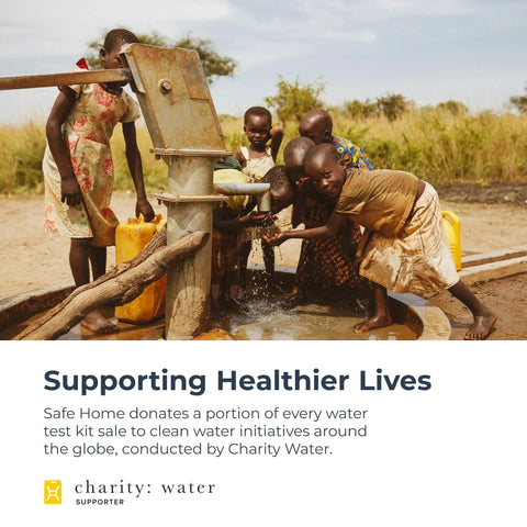 Children pumping water from a well, supported by Safe Home's water test kit sales charity initiative with Charity Water.