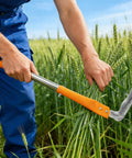 Person using Adjustable Long Handled Weeding Sickle with High Carbon Steel Blade to cut wheat in a field