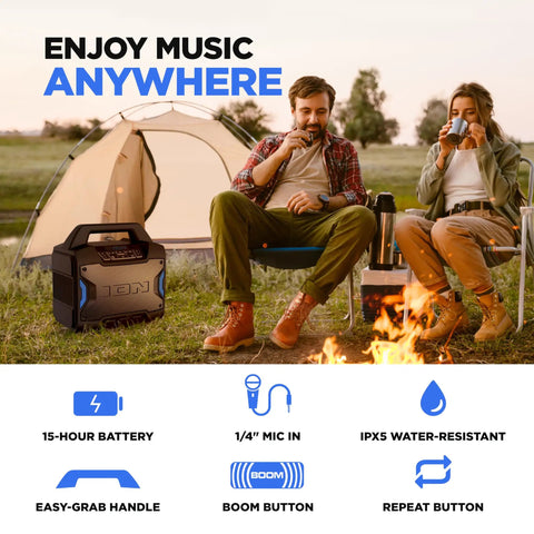 Tailgater Boom Outdoor Portable Bluetooth Speaker With Mic In FM Radio USB Port Battery IPX5 Water Resistant Wireless Stereo Link App Control 60W Peak Power next to tent and people enjoying campfire