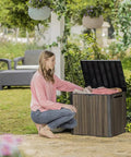 Woman using Backyard Must-Have Everwood 30 Gallon Resin Outdoor Storage Box And Patio Side Table For Pool And Garden Accessories Walnut Finish