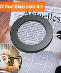 Person using 10X LED Desk Magnifier With Stand And Real Glass Lens to read fine print on a newspaper.