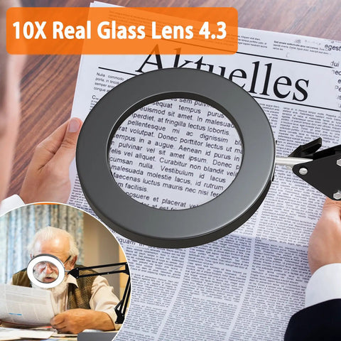 Person using 10X LED Desk Magnifier With Stand And Real Glass Lens to read fine print on a newspaper.