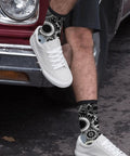 Man wearing Gearhead Engineering Crew Socks for Men and Women Funny Mechanical Novelty Footwear next to vintage car