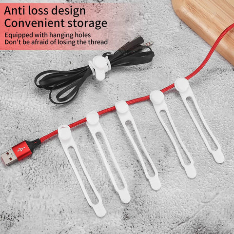 Set of white silicone cable ties securing USB cords, part of the Must Have 25 Silicone Cable Ties Set For Home Office And Kitchen.