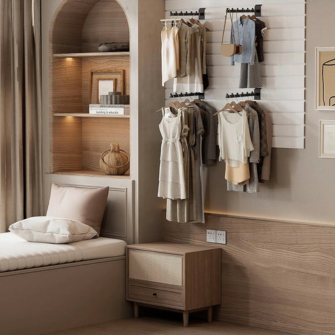 Room with 12 Inch Waterfall Slatwall Display Hooks, 6 Pack installed on wall holding clothing and accessories.