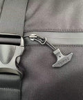 Built-To-Last T-Shape Zipper Pulls With Eco-Friendly TPU Cord Handle And Durable Nylon on backpack zipper, close-up view.