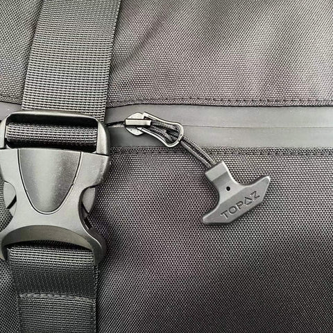 Built-To-Last T-Shape Zipper Pulls With Eco-Friendly TPU Cord Handle And Durable Nylon on backpack zipper, close-up view.