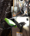 Beefy 2400 Lumen LED Work Light with foldable magnetic base illuminating a metal surface in a workshop setting