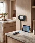 Heavy Duty Dual Motor Electric Actuator Controller With Wireless Remote And Wired Hall Sensor For Smart Home Furniture And Lifting Tables DC24V US Plug mounted on kitchen wall with remote and tablet.