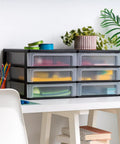 Stacking Desk Top 3 Drawer Storage Organizer, 2 Pack, for makeup, stationery, black on desk with plants, 6 clear drawers visible.