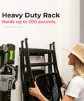 Person using Garage Tool Organizer Wall Mount 32 Inch Heavy Duty Rack With Adjustable Hooks Anti Rust Easy Install Holds Up To 200 Lbs For Shovels Brooms Rakes Power Tools And Garden Gear 02 Racks 04 Hooks on wall.