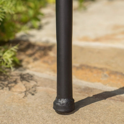 Powder-coated iron leg of slate outdoor ceramic tile side table in blue and white on patio