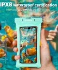 Floatable Waterproof Phone Pouch 2 Pack For Up To 7.0 Inch Devices IPX8 Seal With Easy Snap Lock Keeps Your Phone Safe From Water Snow Dirt Black And Green, held underwater with a diver visible through the pouch.