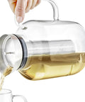 All In One Extra Large Multi Brew Borosilicate Glass Teapot Kettle And Pitcher With Tip And Pour Filter Lid in use.