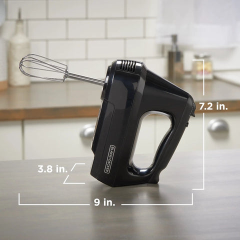 Black Six Speed Easy Storage Hand Mixer With Five Attachments And Case on kitchen countertop, dimensions labeled.