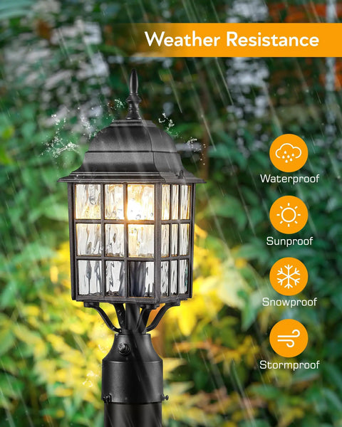 Outdoor Dusk To Dawn Post Light With A 3 Inch Pier Mount Base 19 Inch Tall Exterior Lantern Featuring Tempered Glass Anti Rust Die Cast Aluminum Construction Matte Black Hardwired 120V Lamp Post For Homes And Driveways in rainy garden setting.