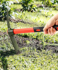 Hand using 15 Inch Forged Steel Pick Mattock Hoe With Fiberglass Handle For Digging Gardening Camping Prospecting And Construction Work A Beast Weeding Tool Built For Tough Jobs on grass