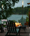 Outdoor Propane Tiki Torch 71 Inch Tall Long Burning Flame Portable Yard And Patio Lighting For Pathways Poolside Garden And Deck Ambiance That Turns Any Space Into A Dope Chill Paradise in a cozy outdoor setting