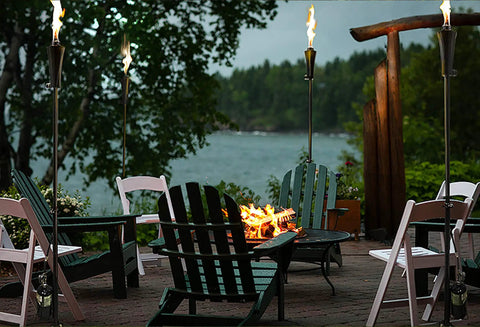 Outdoor Propane Tiki Torch 71 Inch Tall Long Burning Flame Portable Yard And Patio Lighting For Pathways Poolside Garden And Deck Ambiance That Turns Any Space Into A Dope Chill Paradise in a cozy outdoor setting